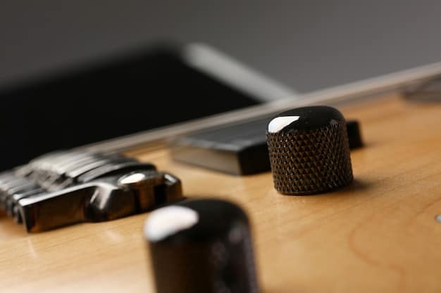 A close-up of a Shure SM58 dynamic microphone on a stand, with a blurry background of a recording studio setup, including a guitar and mixing console.