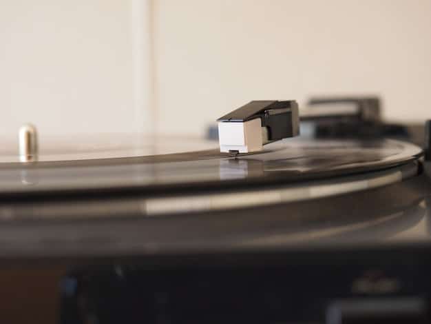 A focused view of a vinyl record spinning on a turntable. The reflective surface of the record shows the intricate grooves where the music is embedded. The background is subtly blurred, highlighting the vintage and timeless aspect of music recording and emphasizing the tangible form of intellectual property being protected.