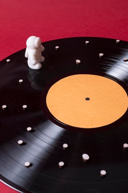 A close-up shot of a vinyl record spinning on a turntable, with the album cover partially visible, symbolizing the connection between artist interviews and the tangible sales of physical music formats.