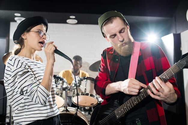 Two members of a rock band sitting down for an interview backstage, surrounded by recording equipment and tour paraphernalia, capturing the candid and intimate setting where exclusive conversations often unfold.