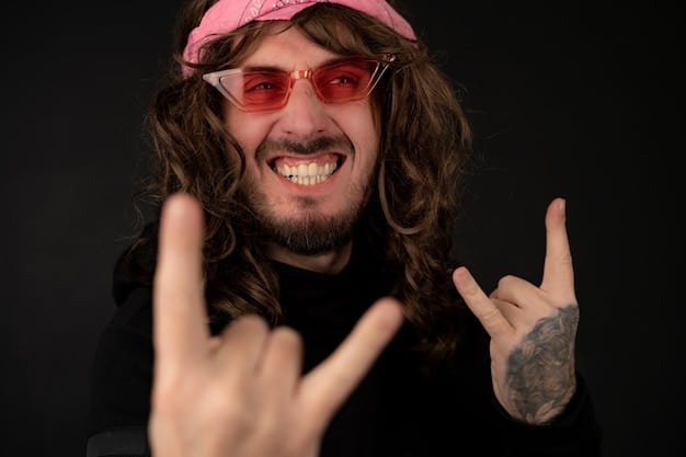 A picture of a rock star smiling to fans after overcoming his drug addiction problems.