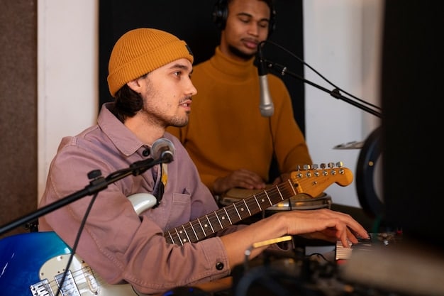 Band members in a recording studio during a session, showing collaborative work and the use of modern recording technology.