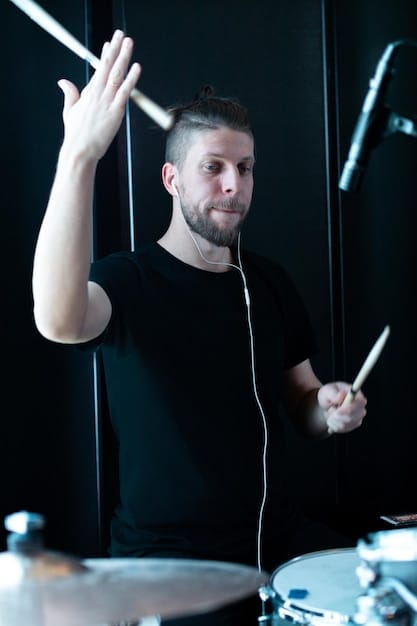 A close-up shot of a drummer from The Velvet Echoes mid-performance. He is sweating and intensely focused, with his hair flying as he hits the drums with power and precision. The background is blurred, highlighting the energy of the performance.