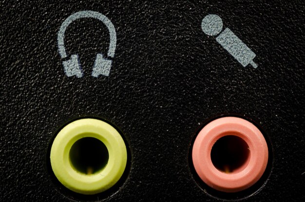 A close-up shot of different types of earplugs, including foam, reusable, and high-fidelity concert earplugs. Text overlay explaining the dB reduction levels.