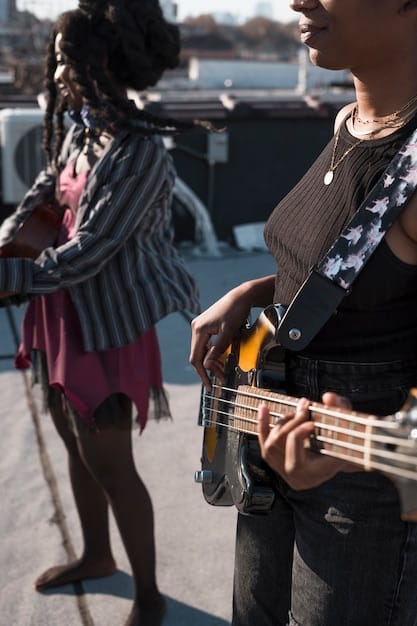 A behind-the-scenes photo of the band during a rehearsal, with the guitarist and lead singer visibly engaged in a heated discussion. The other band members appear uncomfortable and avoid eye contact.