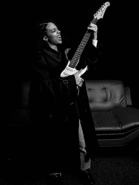 A photo of the rock star sitting in a dimly lit room, looking down with a deeply concerned expression. A bottle is blurred in the foreground, subtly indicating the struggle with addiction. The overall tone is subdued and somber, reflecting the rock bottom moment.