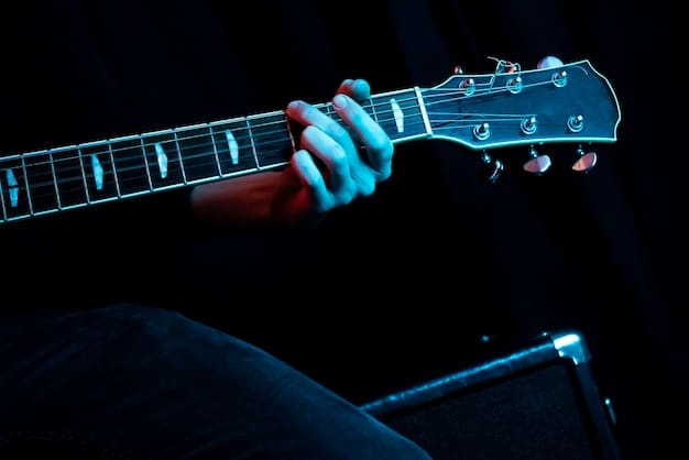 A close-up shot of a rock guitarist's hands passionately playing an electric guitar, with cool lighting and a subtle TikTok logo overlay in the corner.